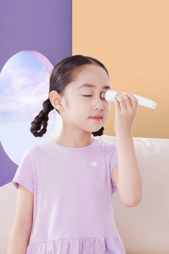 Young girl using the Aiyisheng Heated Bian Stone Eyes Massage Device for eye relaxation and strain relief.