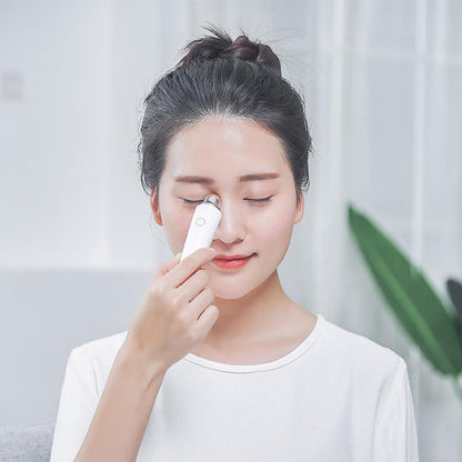Woman using Aiyisheng Heated Bian Stone Eyes Massage Device for eye relaxation